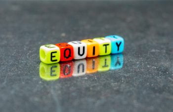Beads spelling out "equity"